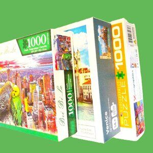 (3) 1000 piece puzzles preowned. These three puzzles are very colorful puzzles